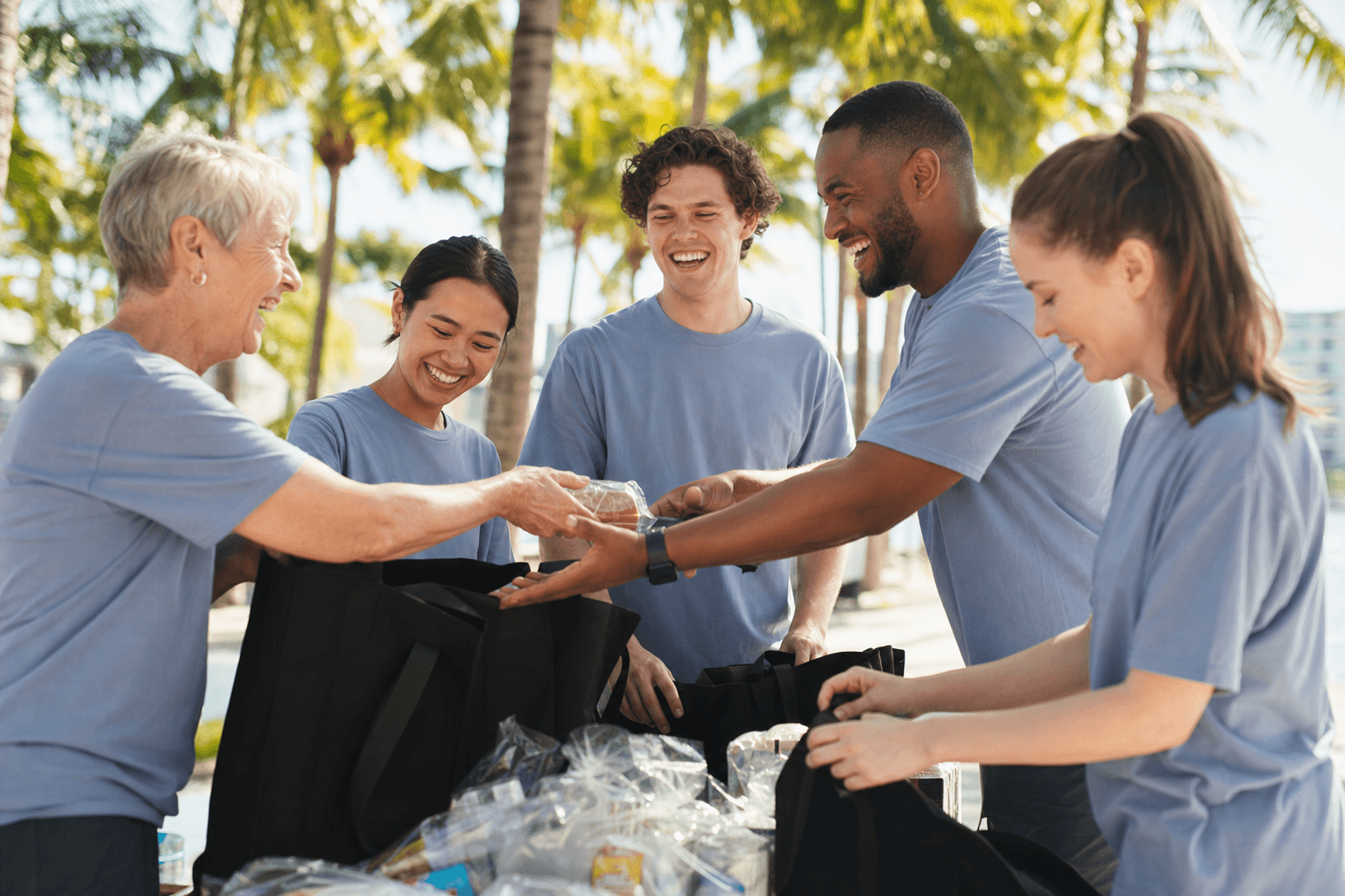 Volunteers assembling care packages outdoors